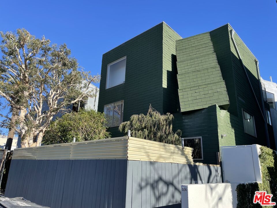 a front view of house with outdoor space