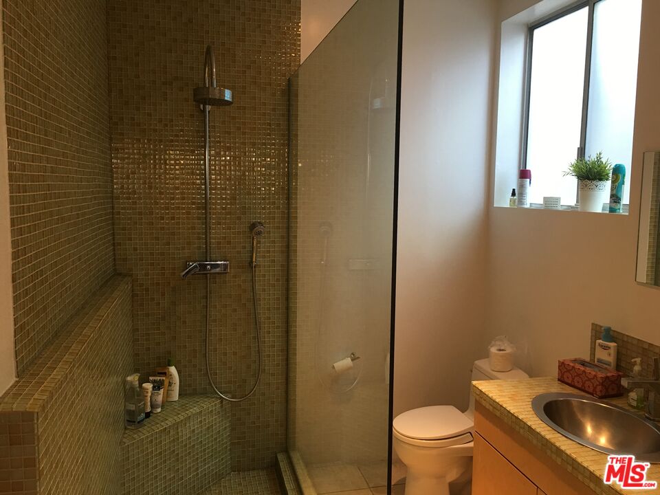 326 Indiana Avenue, Unit A Venice, CA 90291 - Photo 5 of 15 a bathroom with a sink a toilet and shower
