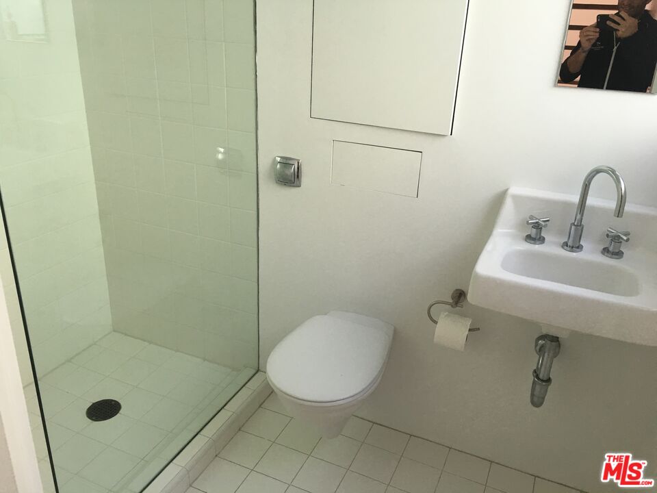 326 Indiana Avenue, Unit A Venice, CA 90291 - Photo 8 of 15 a bathroom with a sink toilet and shower
