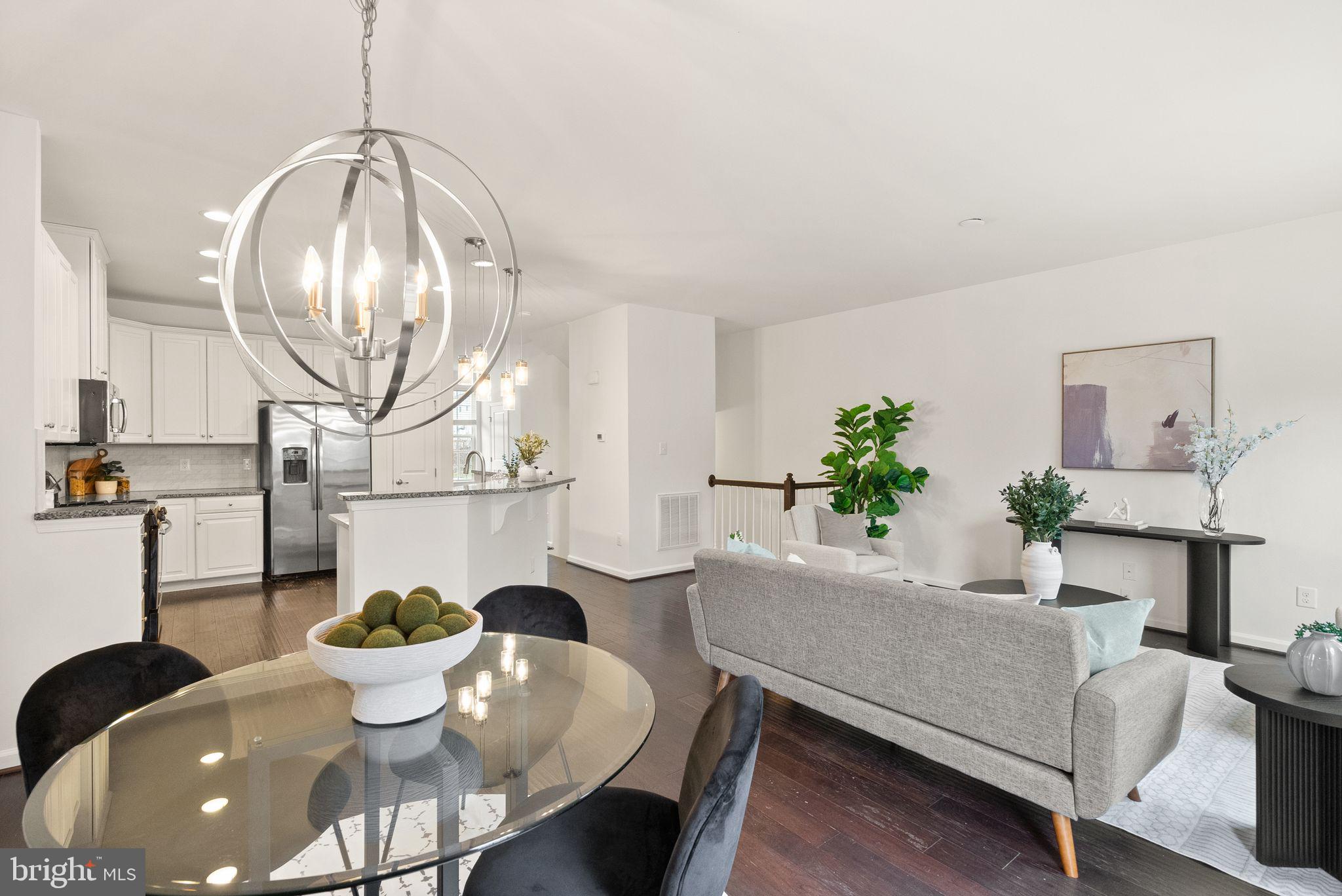 13671 Rockingham Lane Gainesville, VA 20155 - Photo 11 of 45 a living room with furniture a window and a table