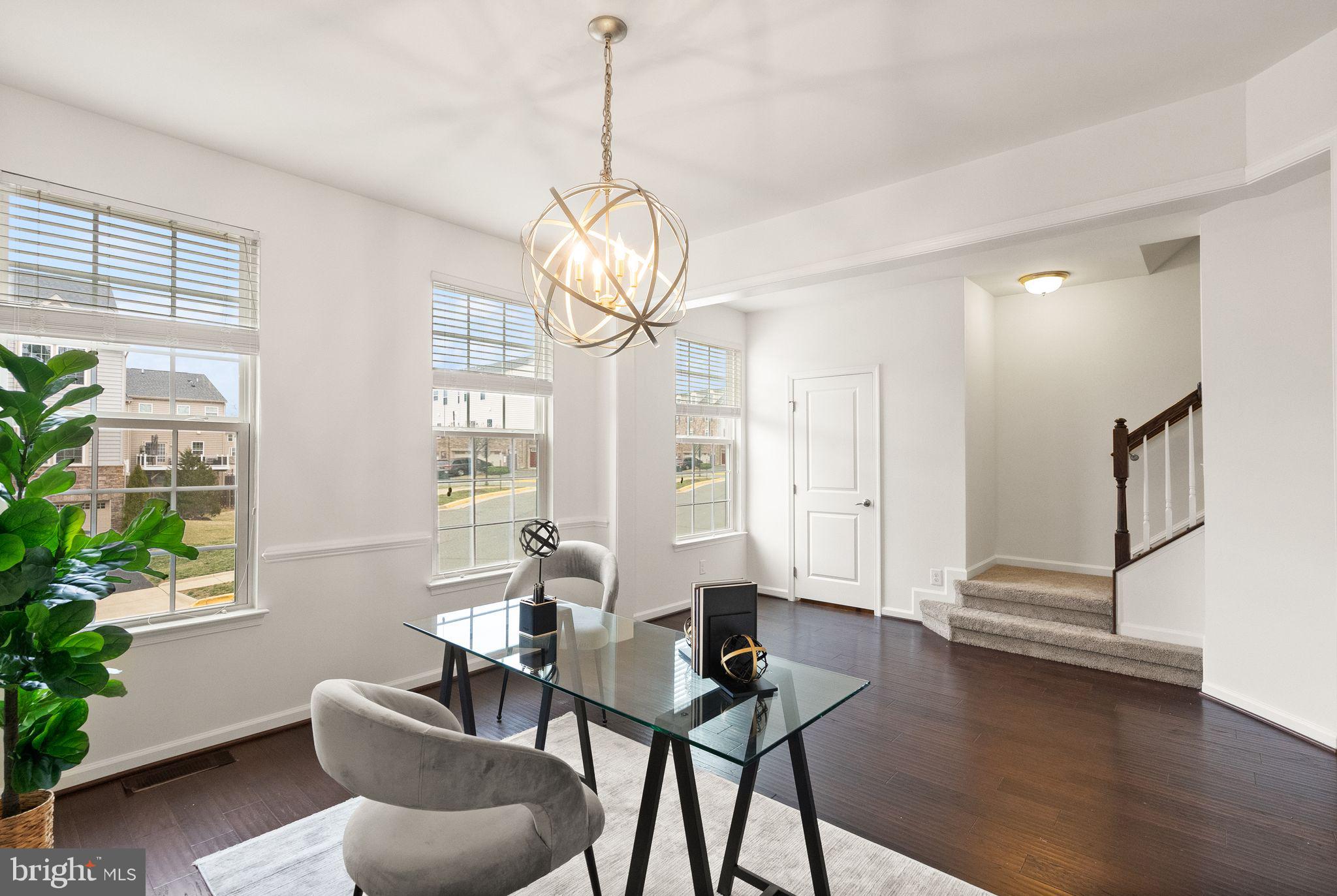 13671 Rockingham Lane Gainesville, VA 20155 - Photo 18 of 45 a view of a livingroom with furniture window and wooden floor