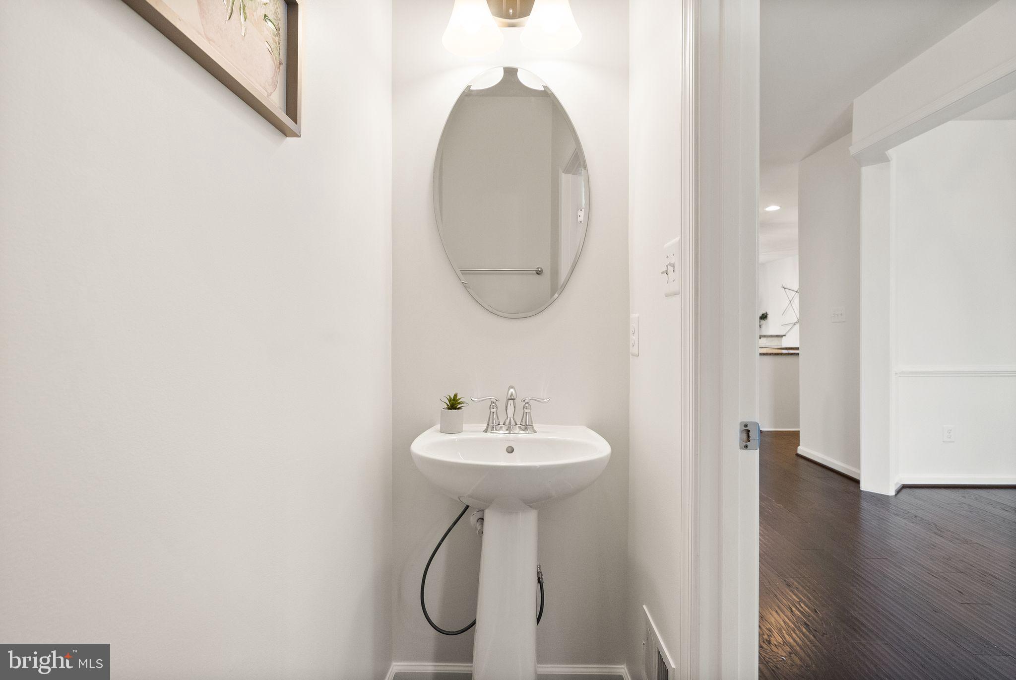 13671 Rockingham Lane Gainesville, VA 20155 - Photo 19 of 45 a bathroom with a sink and a mirror