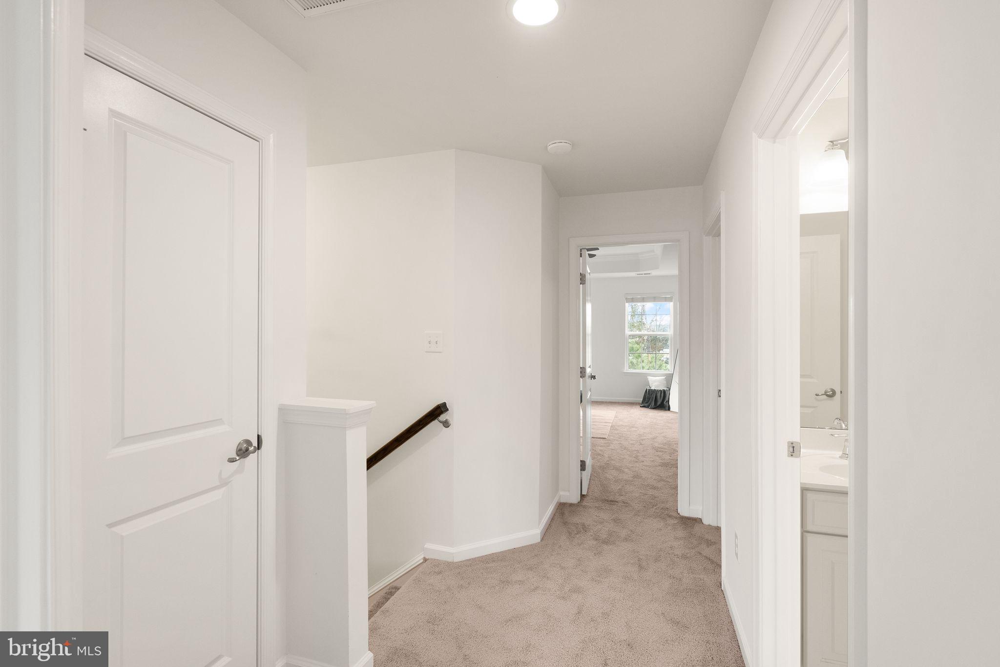 13671 Rockingham Lane Gainesville, VA 20155 - Photo 20 of 45 a view of a hallway with wooden floor