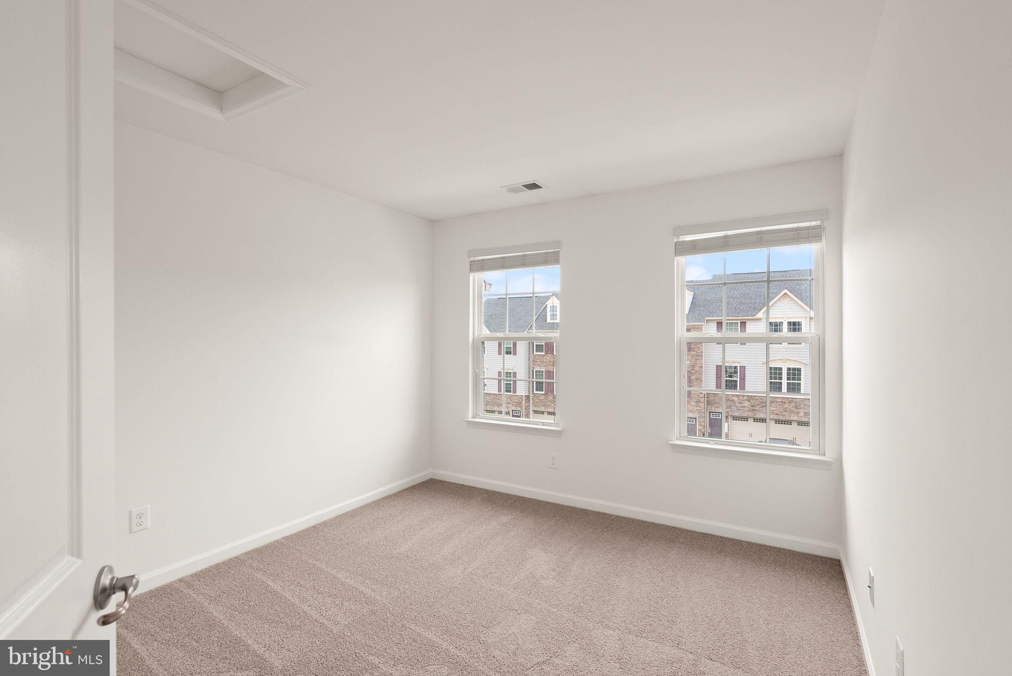 13671 Rockingham Lane Gainesville, VA 20155 - Photo 28 of 45 a view of an empty room with windows
