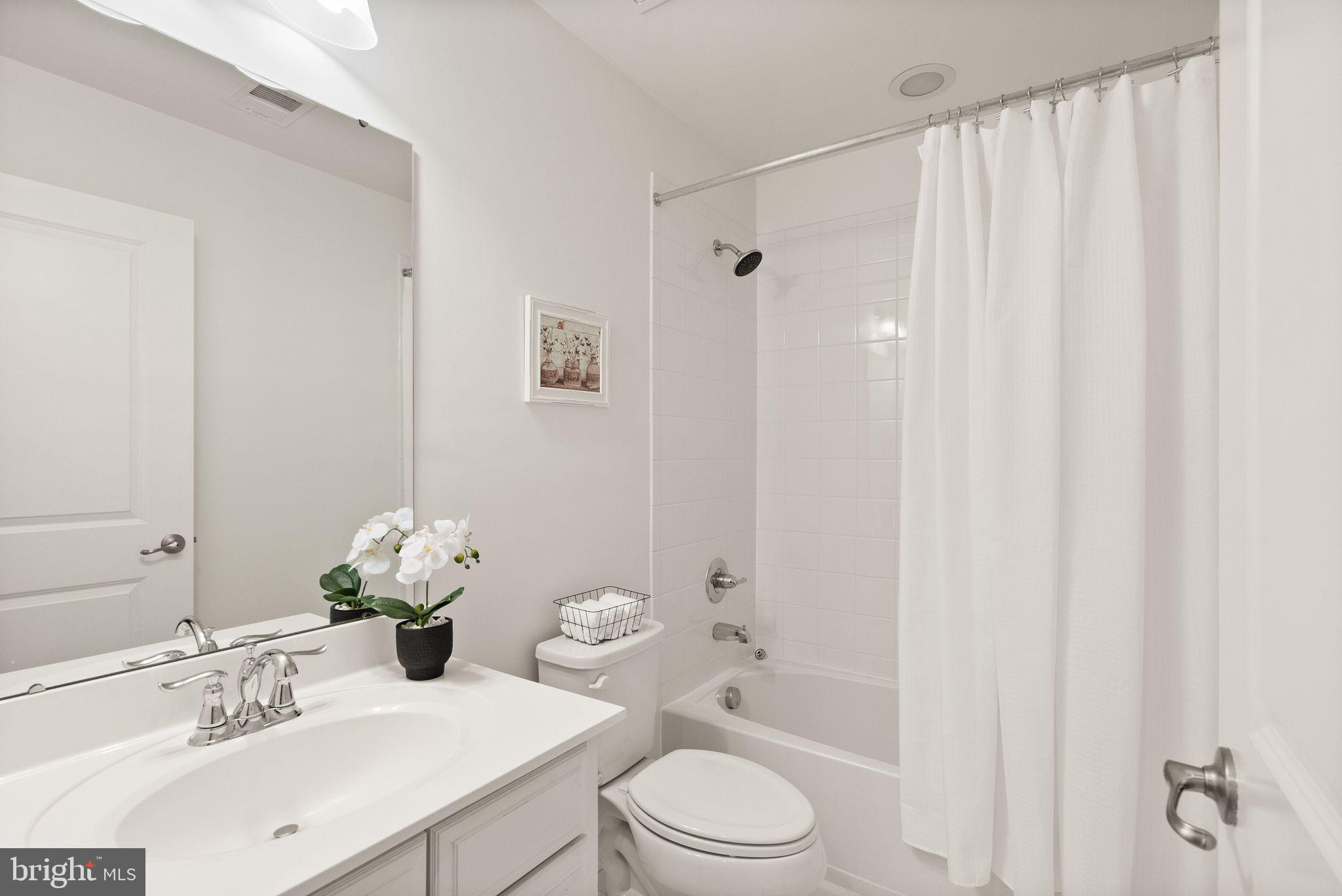 13671 Rockingham Lane Gainesville, VA 20155 - Photo 32 of 45 a bathroom with a sink toilet and shower