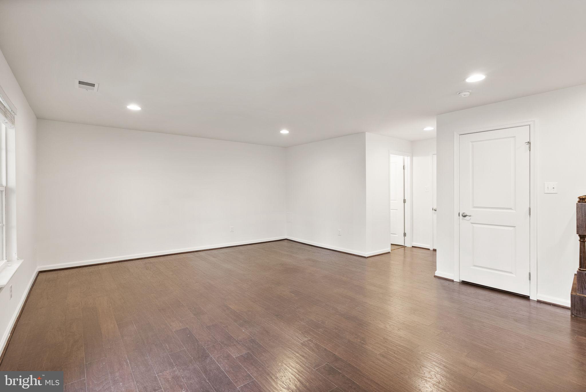 13671 Rockingham Lane Gainesville, VA 20155 - Photo 36 of 45 a view of an empty room with wooden floor