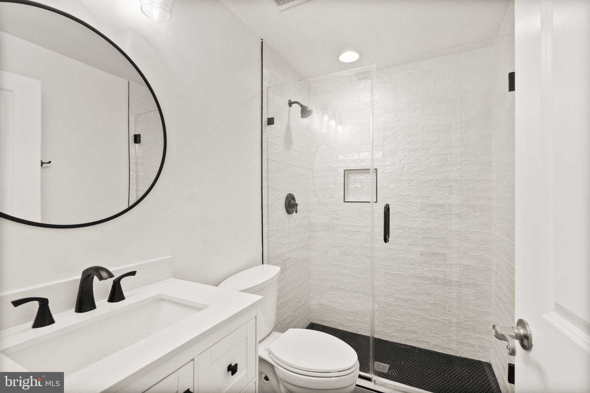 13671 Rockingham Lane Gainesville, VA 20155 - Photo 37 of 45 a bathroom with a sink a toilet and shower