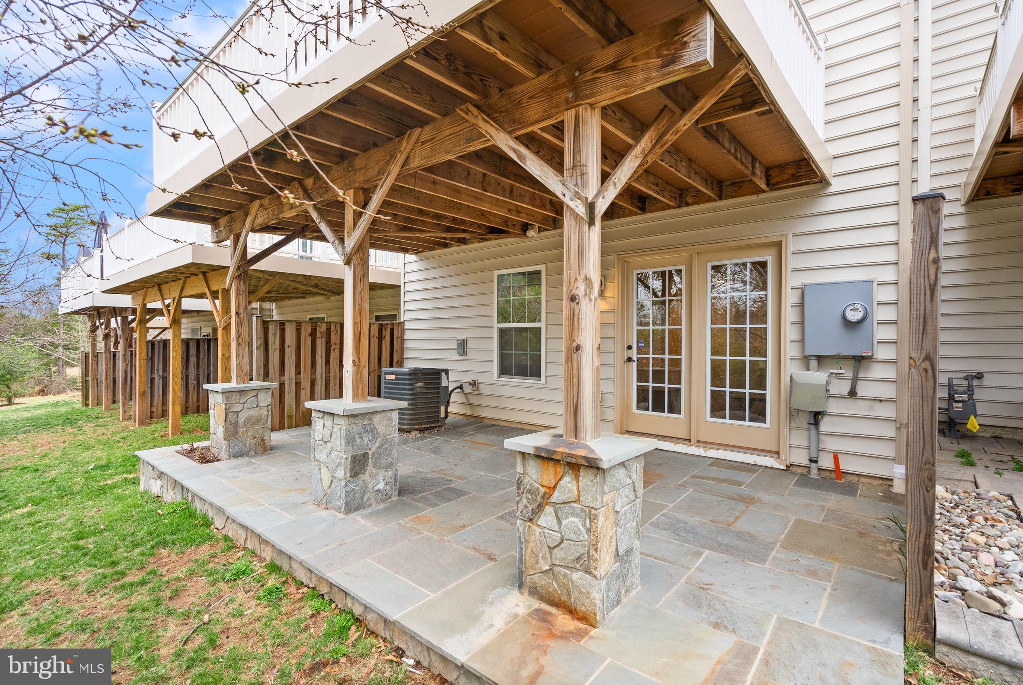 13671 Rockingham Lane Gainesville, VA 20155 - Photo 38 of 45 a view of a dinning table and chairs in the patio