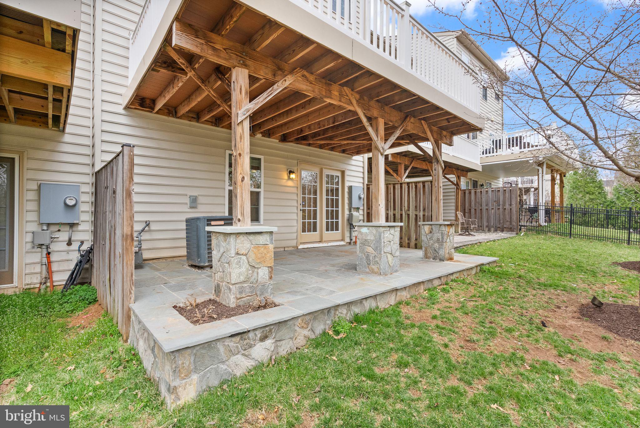 13671 Rockingham Lane Gainesville, VA 20155 - Photo 39 of 45 a view of a house with backyard and sitting area