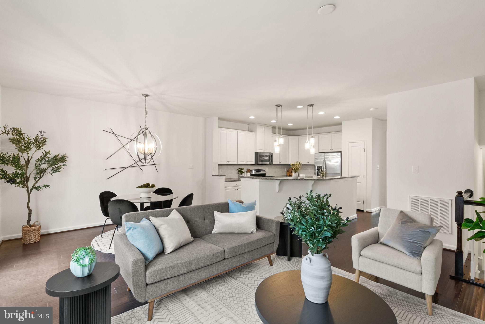 13671 Rockingham Lane Gainesville, VA 20155 - Photo 8 of 45 a living room with furniture kitchen view and a potted plant