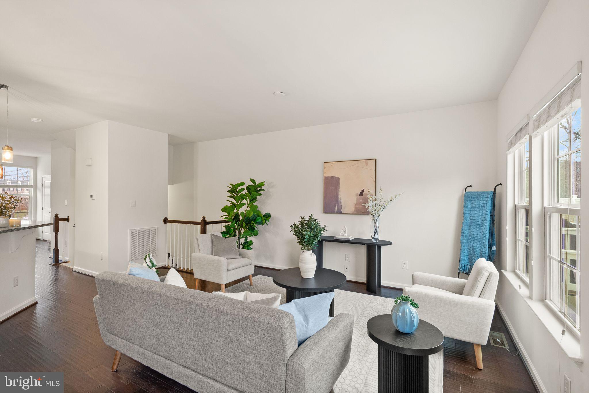 13671 Rockingham Lane Gainesville, VA 20155 - Photo 9 of 45 a living room with furniture and a large window