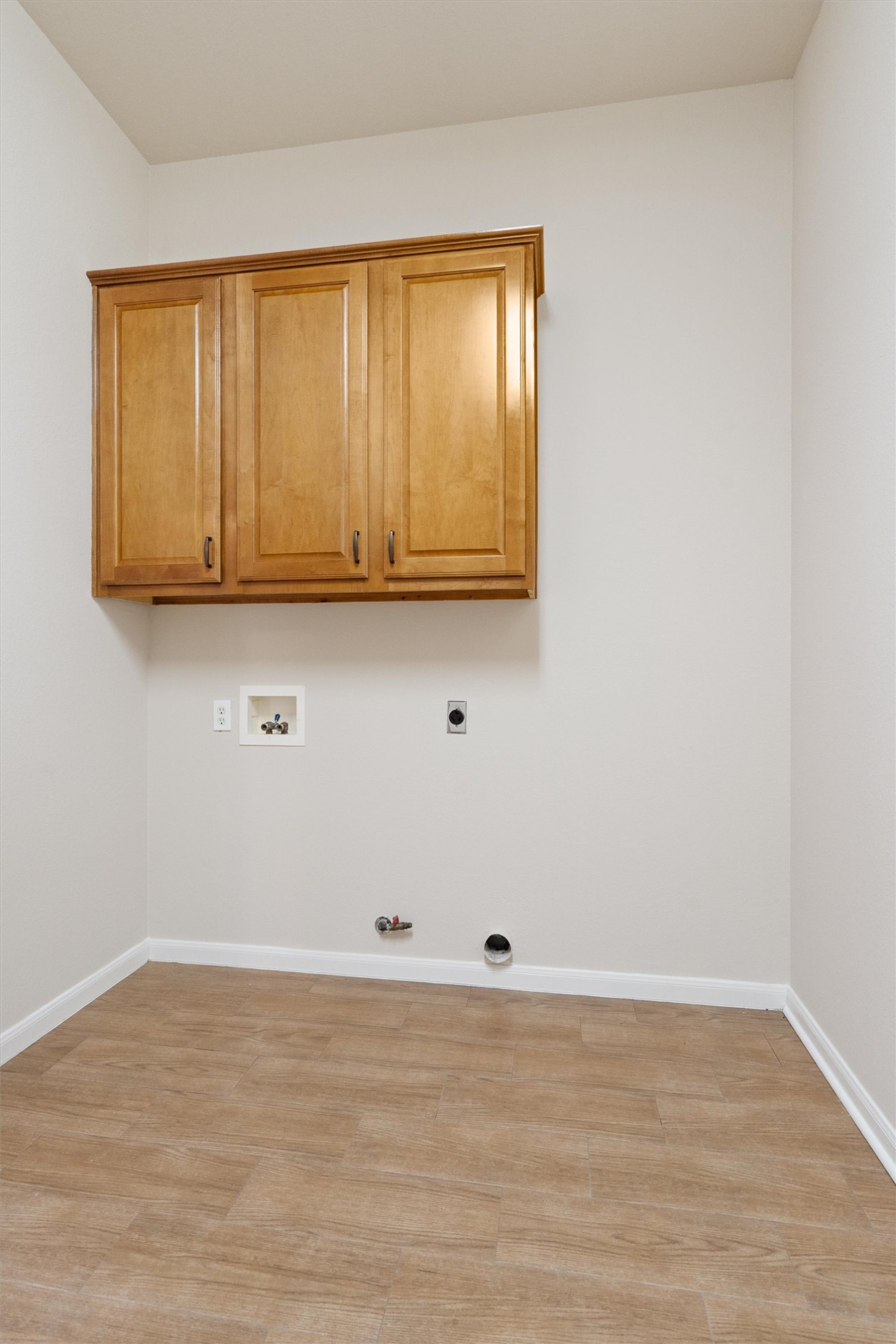 108 Cattle Trail Way Georgetown, TX 78633 - Photo 32 of 40 Laundry Room has extra cabinets for storage.