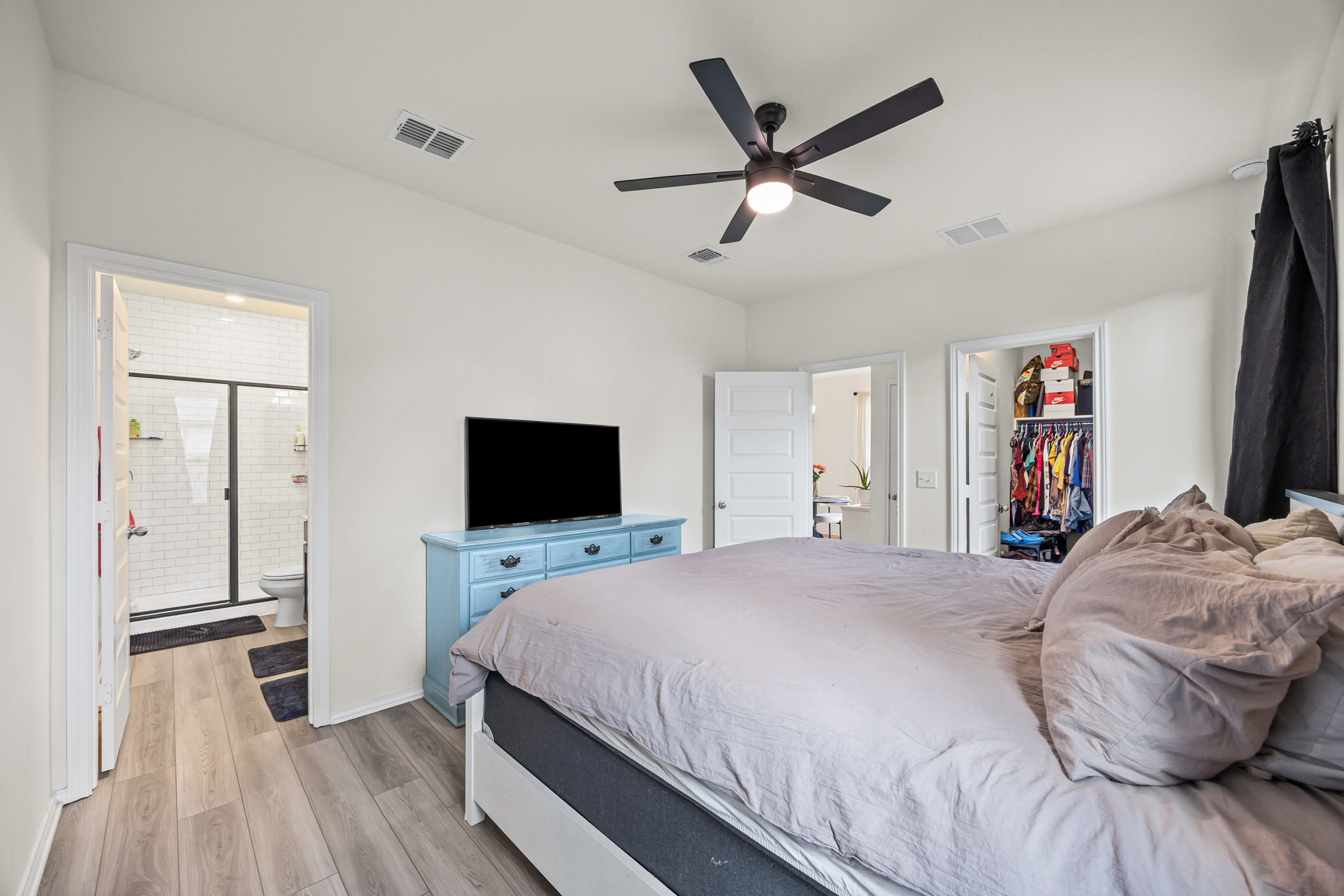 222 Summit Drive Lockhart, TX 78644 - Photo 14 of 31 a bedroom with a bed and a flat screen tv