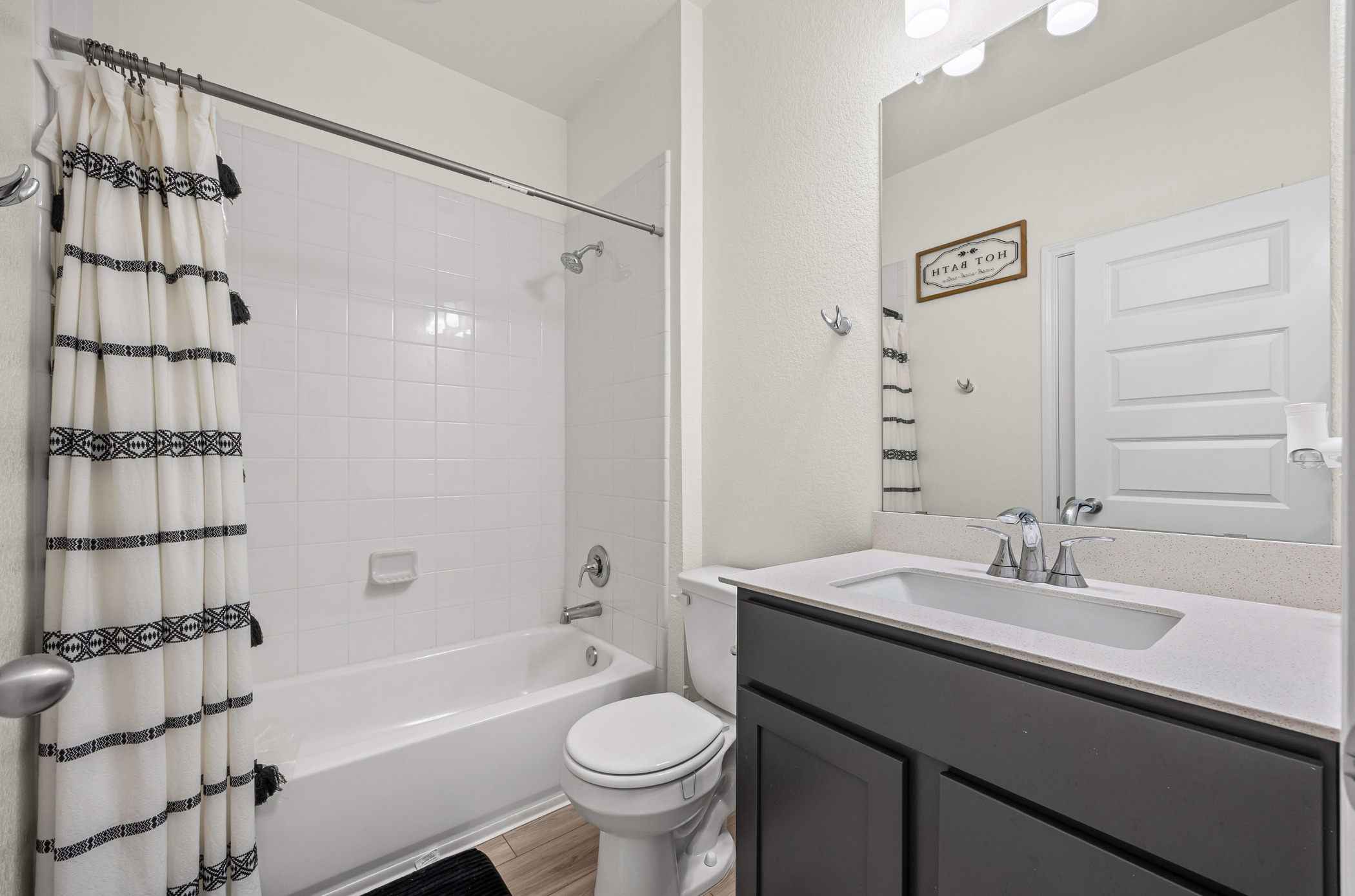 222 Summit Drive Lockhart, TX 78644 - Photo 20 of 31 a bathroom with a sink a toilet and shower