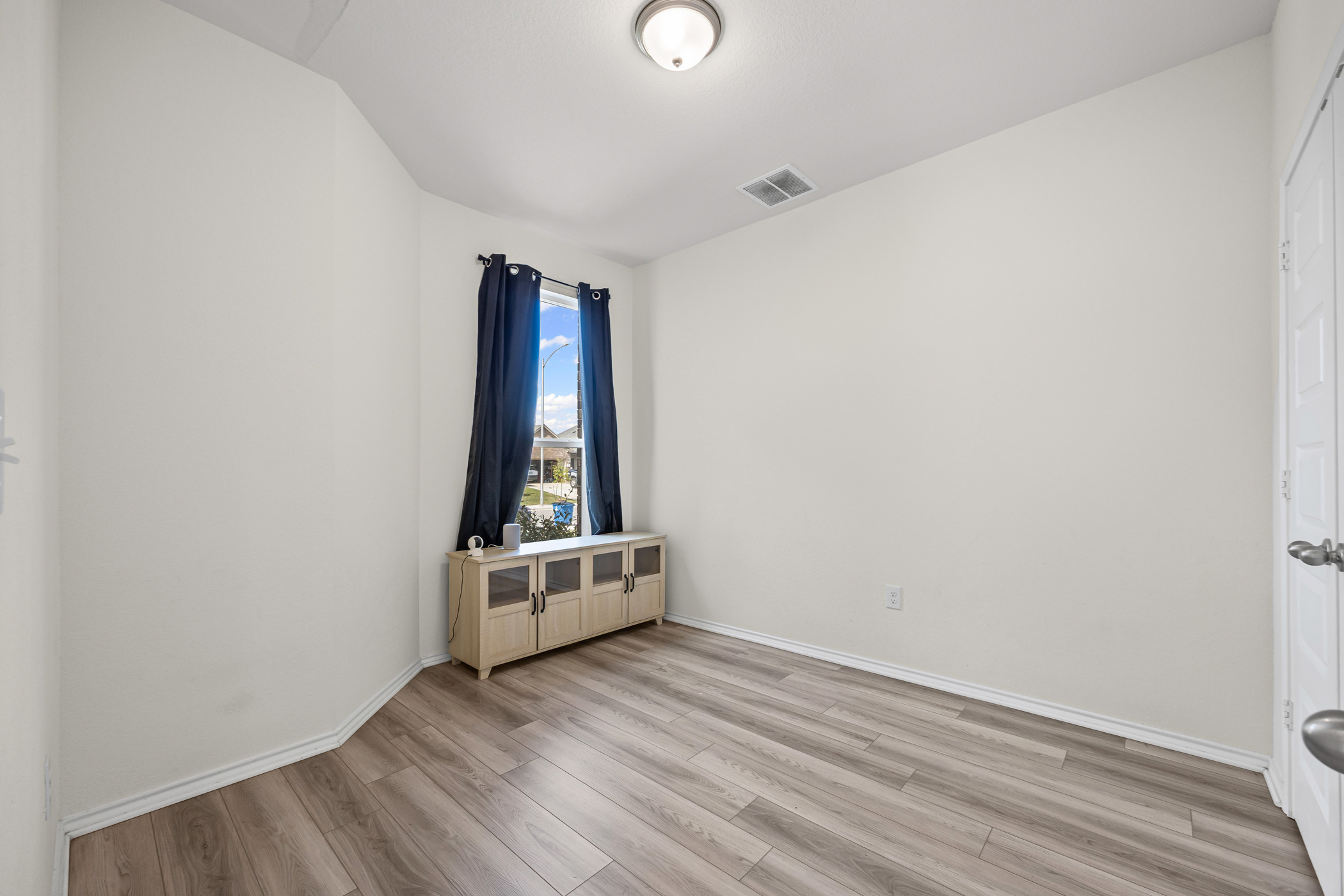 222 Summit Drive Lockhart, TX 78644 - Photo 21 of 31 wooden floor in an empty room