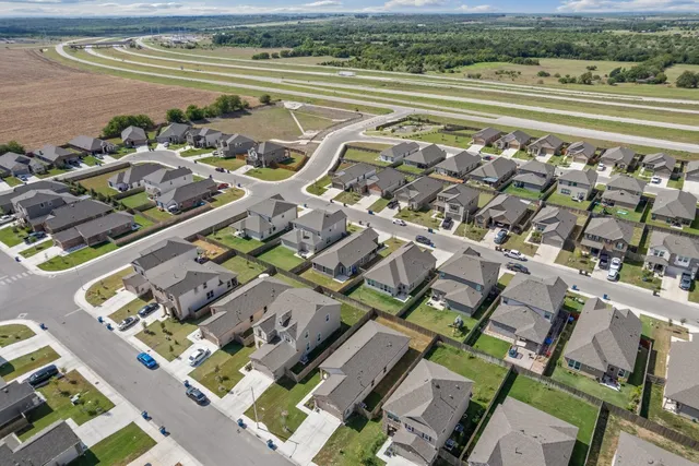 an aerial view of a house with a lake view