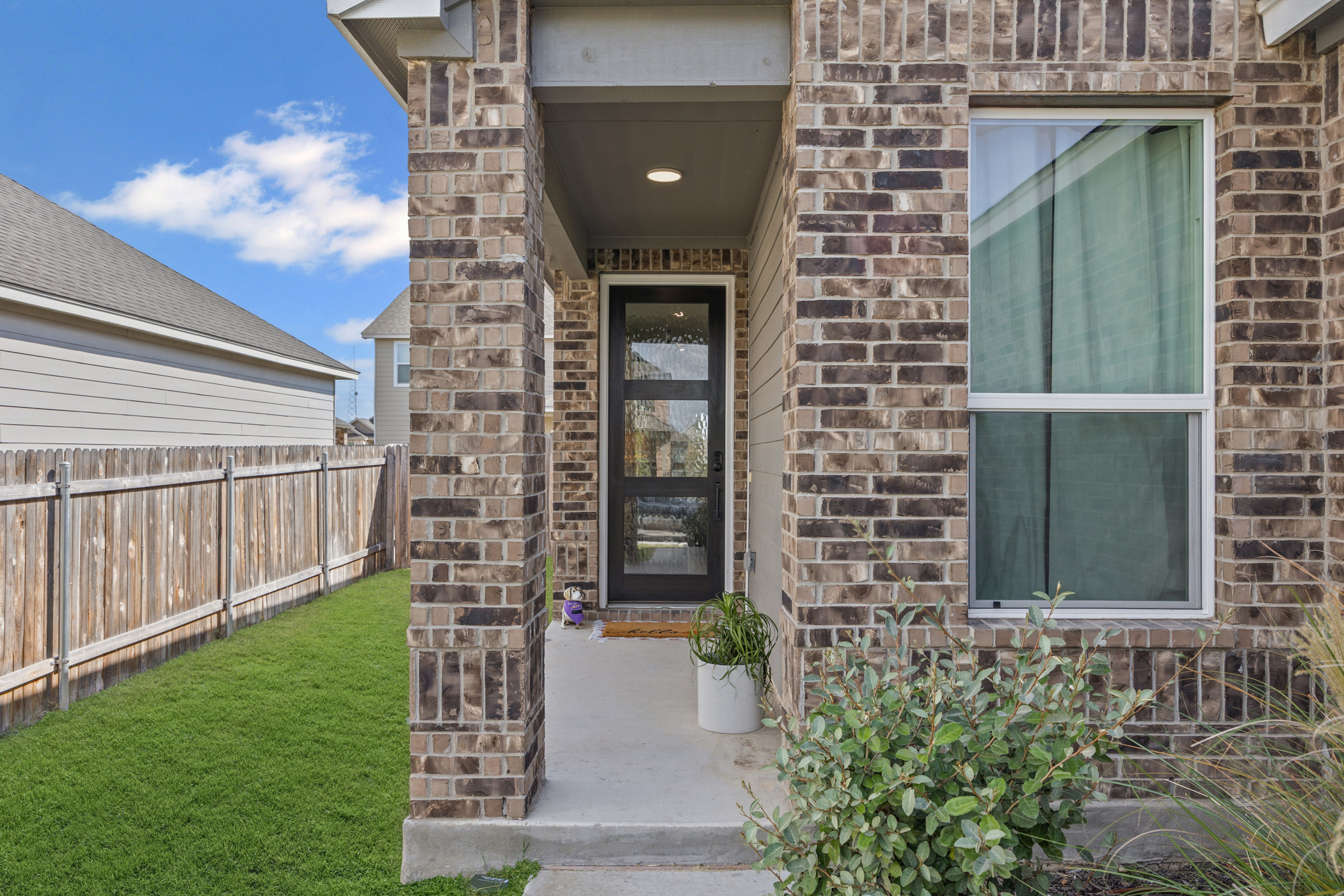 222 Summit Drive Lockhart, TX 78644 - Photo 3 of 31 a front view of a house with a garden
