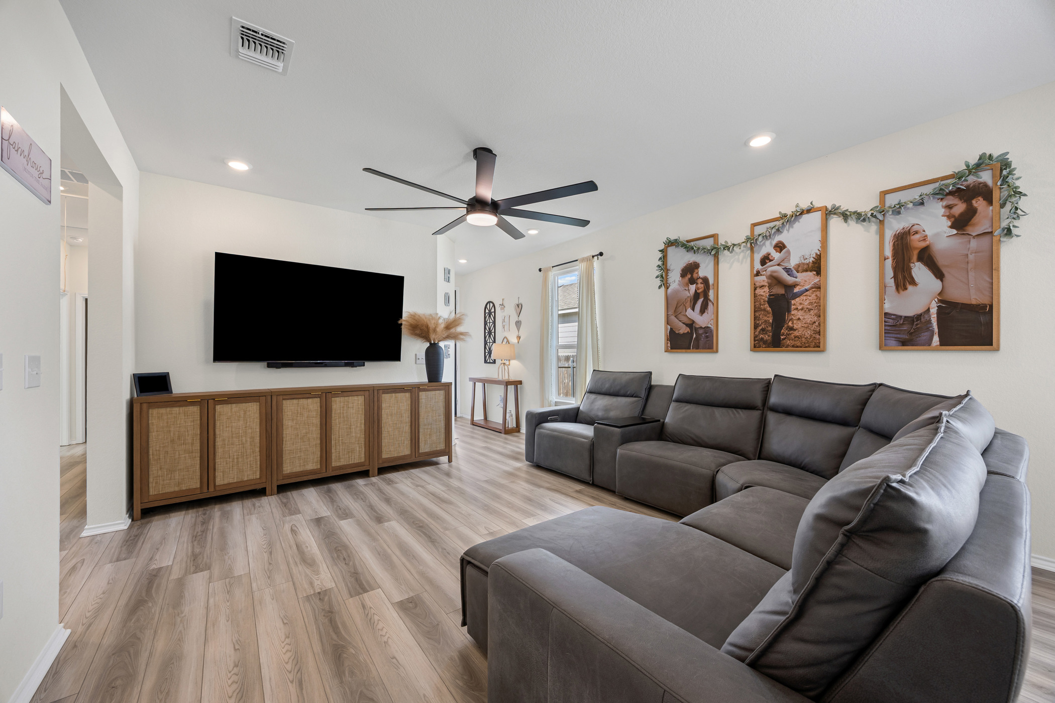 222 Summit Drive Lockhart, TX 78644 - Photo 5 of 31 a living room with furniture and a flat screen tv