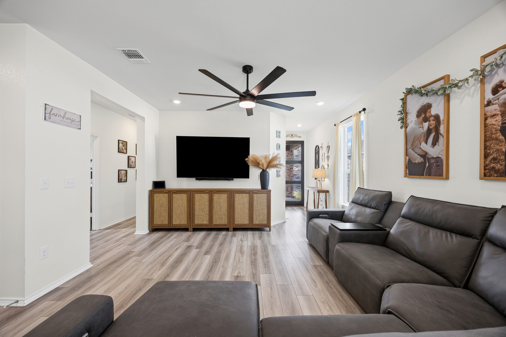 222 Summit Drive Lockhart, TX 78644 - Photo 6 of 31 a living room with furniture and a flat screen tv