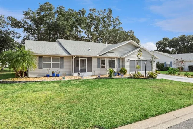 a front view of a house with a garden and porch