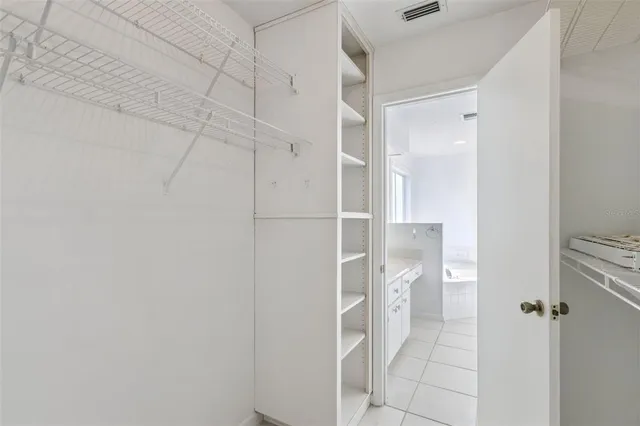 a view of a storage & utility room with a sink