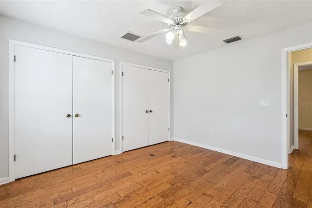 an aerial view of residential houses with outdoor space and swimming pool