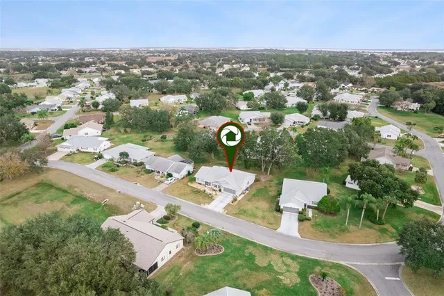 an aerial view of a house with swimming pool