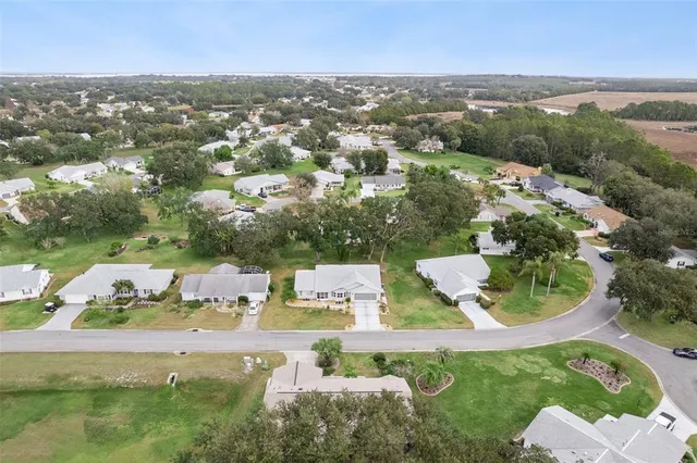 a view of a patio with table and chairs under an umbrella