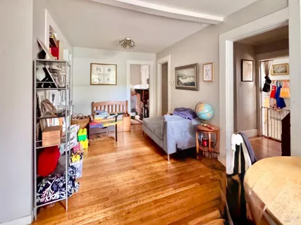 a reading room with furniture and a window
