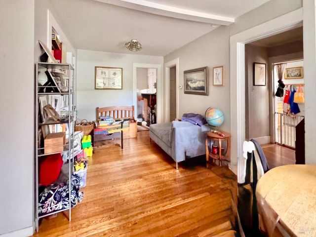 a reading room with furniture and a window