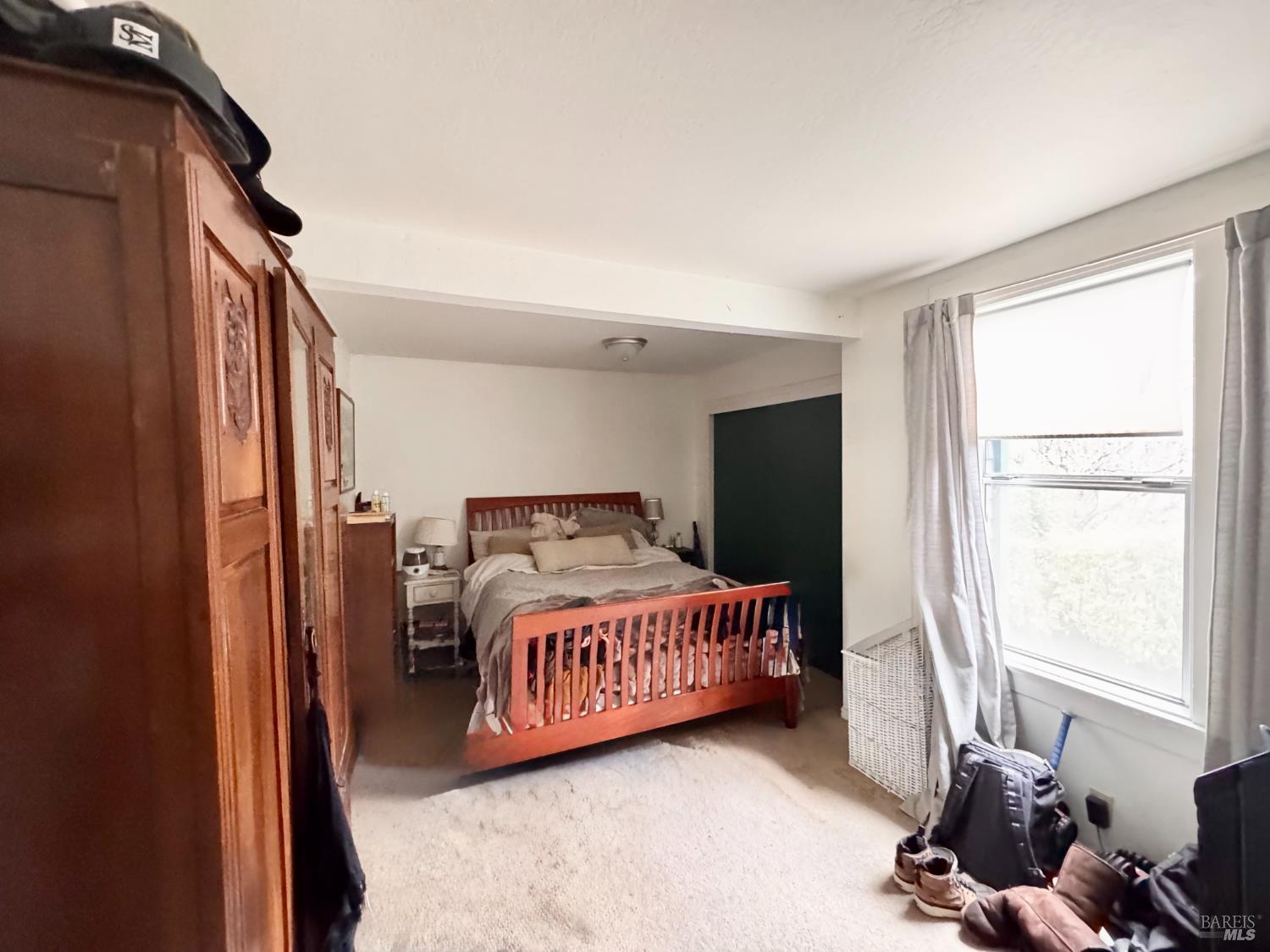 55-61 Park Road Fairfax, CA 94930 - Photo 19 of 26 a bedroom with a bed and a window