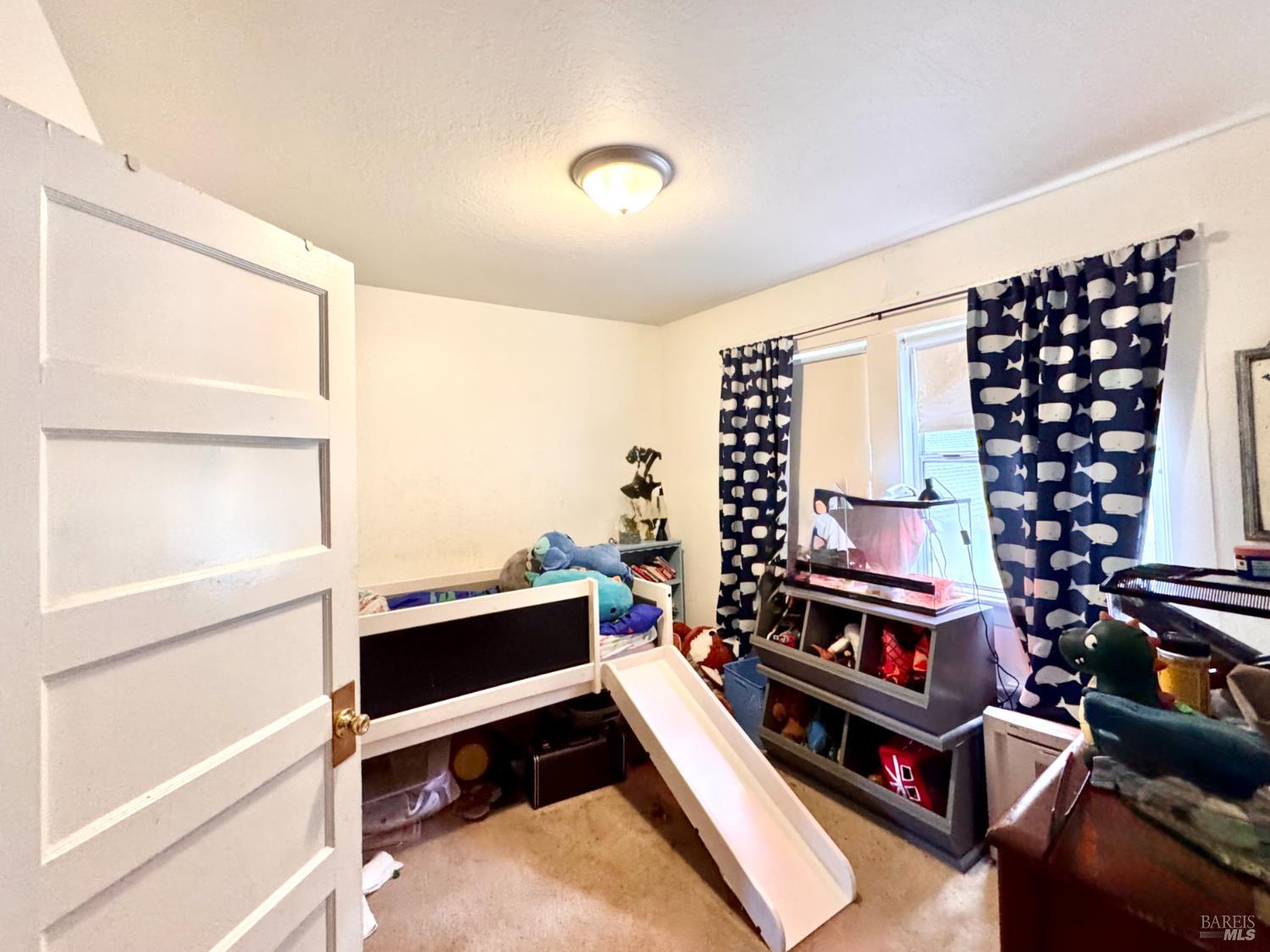 55-61 Park Road Fairfax, CA 94930 - Photo 20 of 26 a reading room with furniture and a window