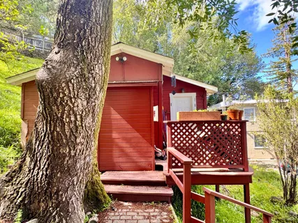 a view of a wooden door with a bench