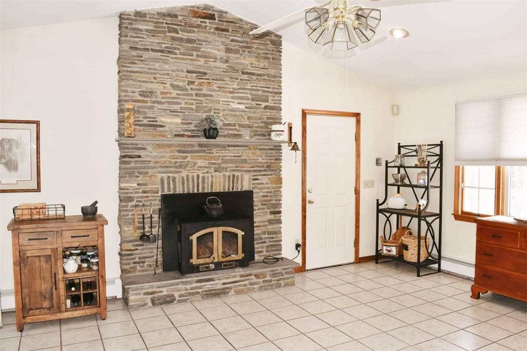200 Joe Sarle Road Glocester, RI 02814 - Photo 4 of 37 wood stove kitchen area