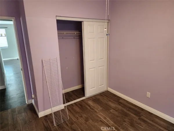 a view of front door with wooden floor