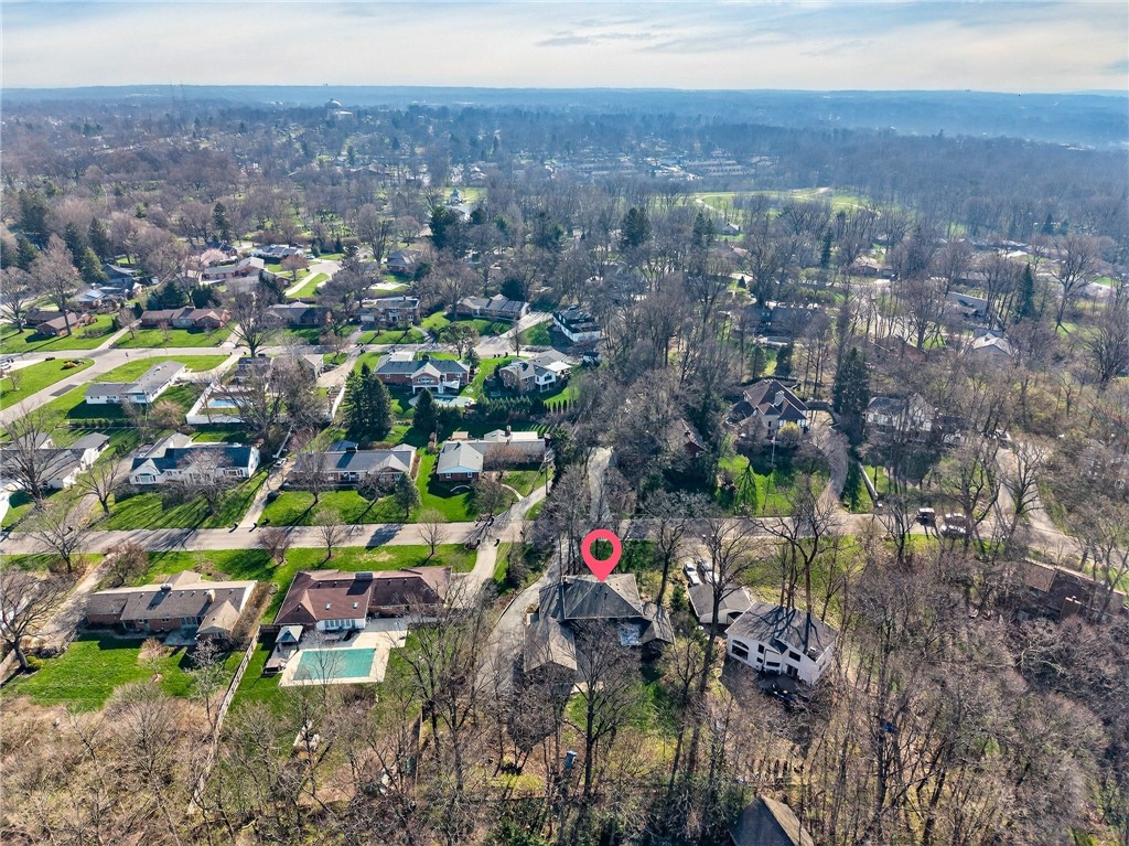 4747 Fawnwood Road Dayton, OH 45429 - Photo 57 of 58 This elevated view captures a serene residential landscape nestled among lush greenery, with a prominent home highlighted.