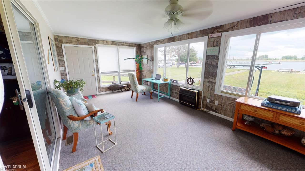 6013 Pointe Tremble Road Algonac, MI 48001 - Photo 10 of 26 Spacious sunroom with view of water