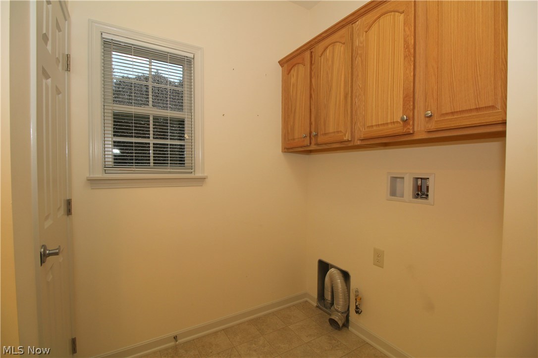 1930 Knight Road Akron, OH 44306 - Photo 13 of 25 Laundry area - located within the extra large guest bath area, plenty of cabinets to store your laundry detergent and extra large pantry as well!