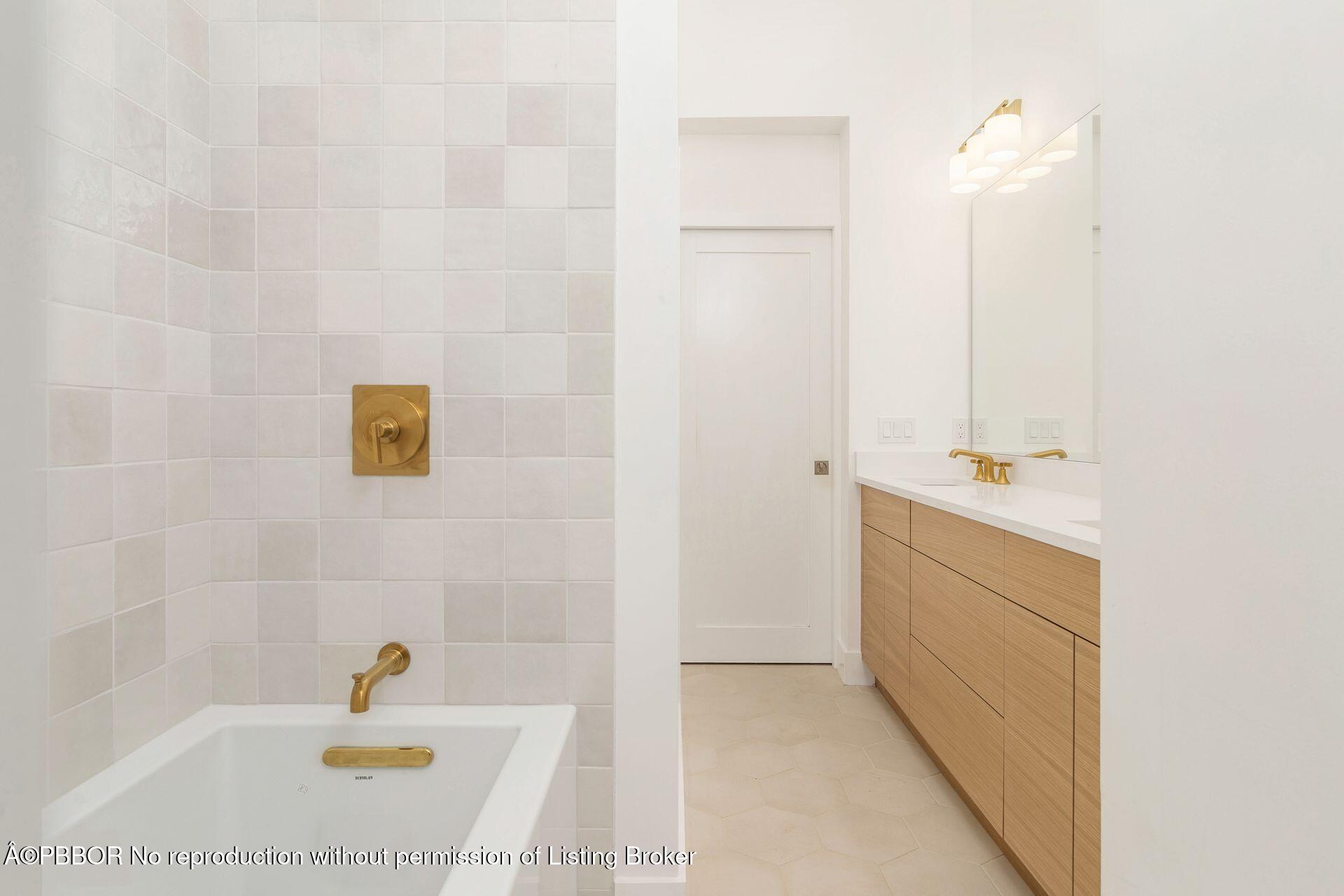 320 Plymouth Road West Palm Beach, FL 33405 - Photo 20 of 39 a bathroom with a tub sink and mirror