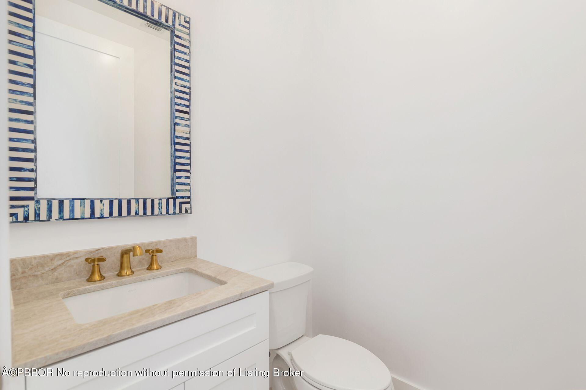 320 Plymouth Road West Palm Beach, FL 33405 - Photo 23 of 39 a bathroom with a granite countertop sink and a toilet