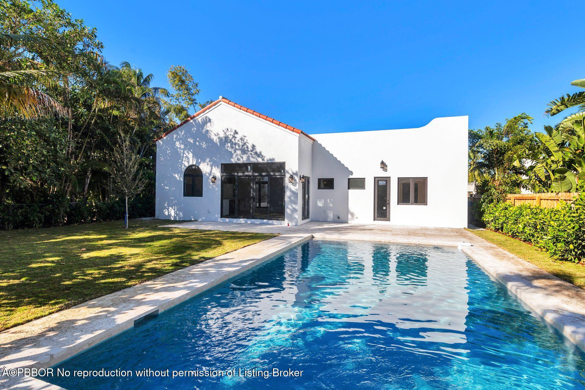 320 Plymouth Road West Palm Beach, FL 33405 - Photo 26 of 39 a view of a house with pool and a yard