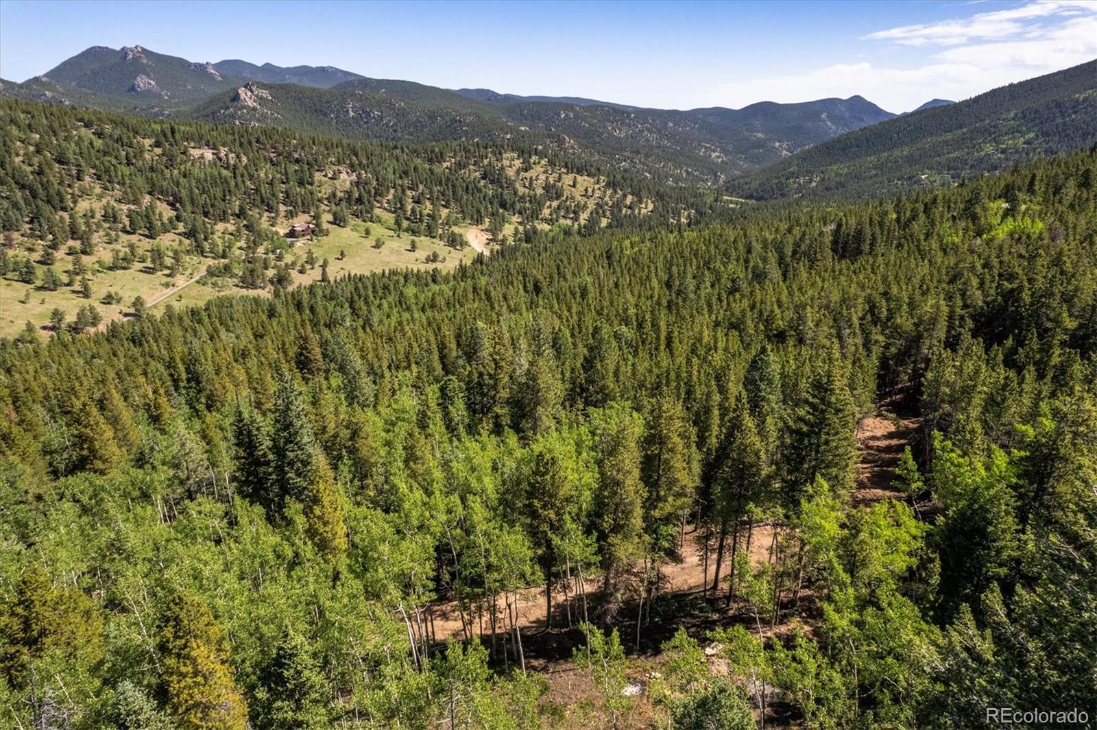 3450 Smith Hill Road Black Hawk, CO 80422 - Photo 6 of 26 a view of a town with mountains in the background