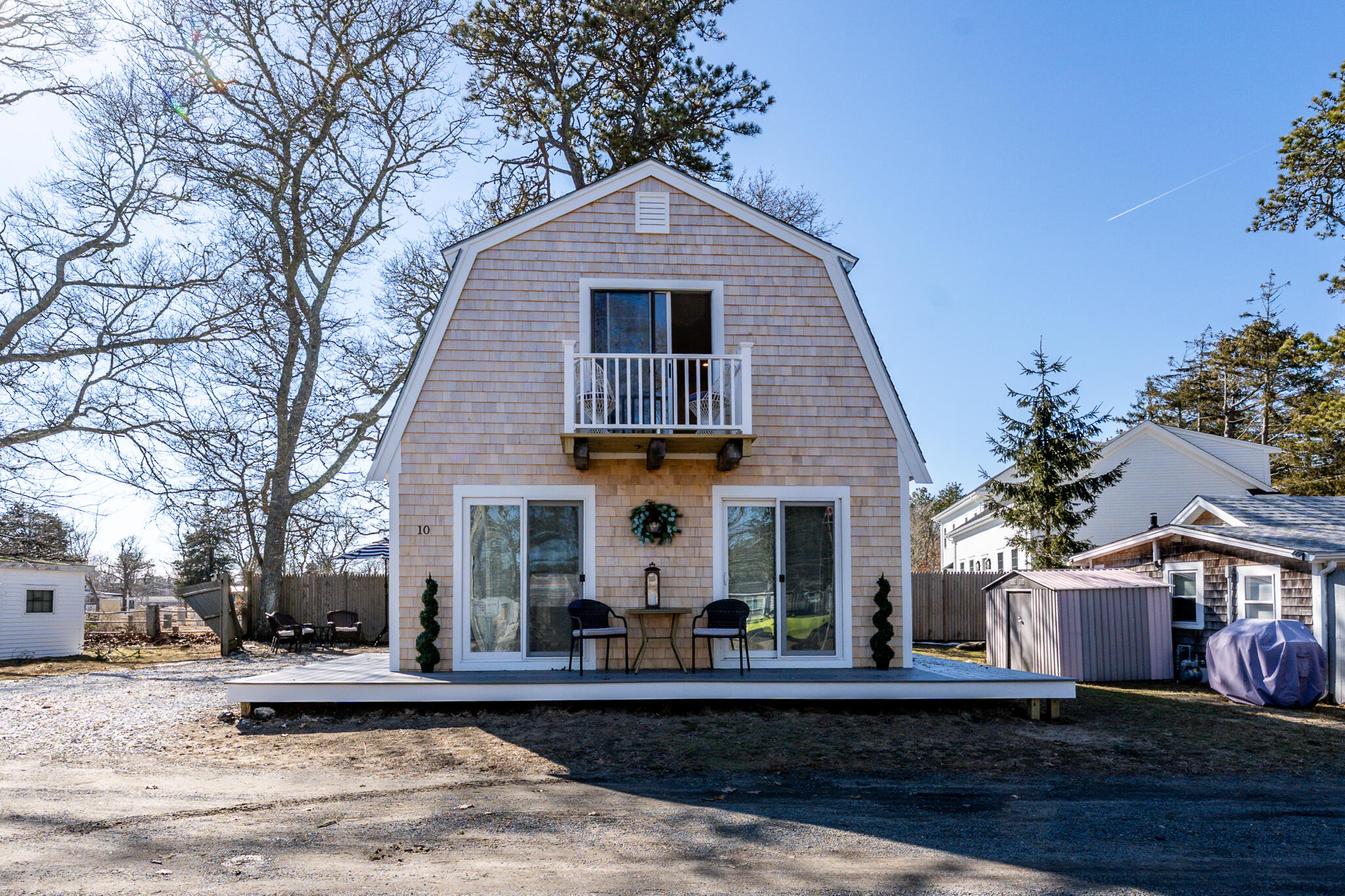 9 Bells Neck Road, Unit 10 Harwich, MA 02671 - Photo 2 of 39 a front view of a house with garden
