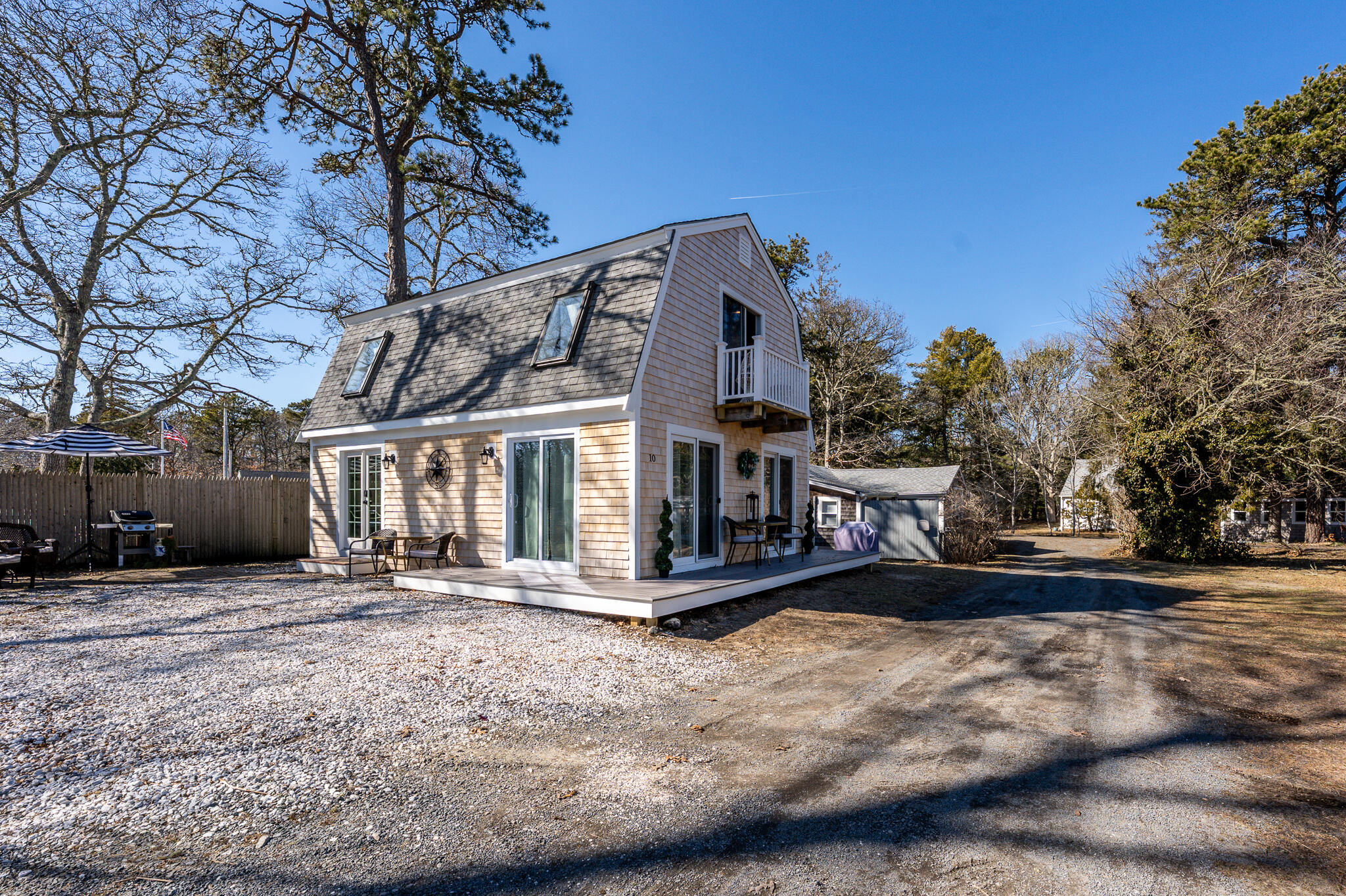 9 Bells Neck Road, Unit 10 Harwich, MA 02671 - Photo 3 of 39 a view of a house with a yard