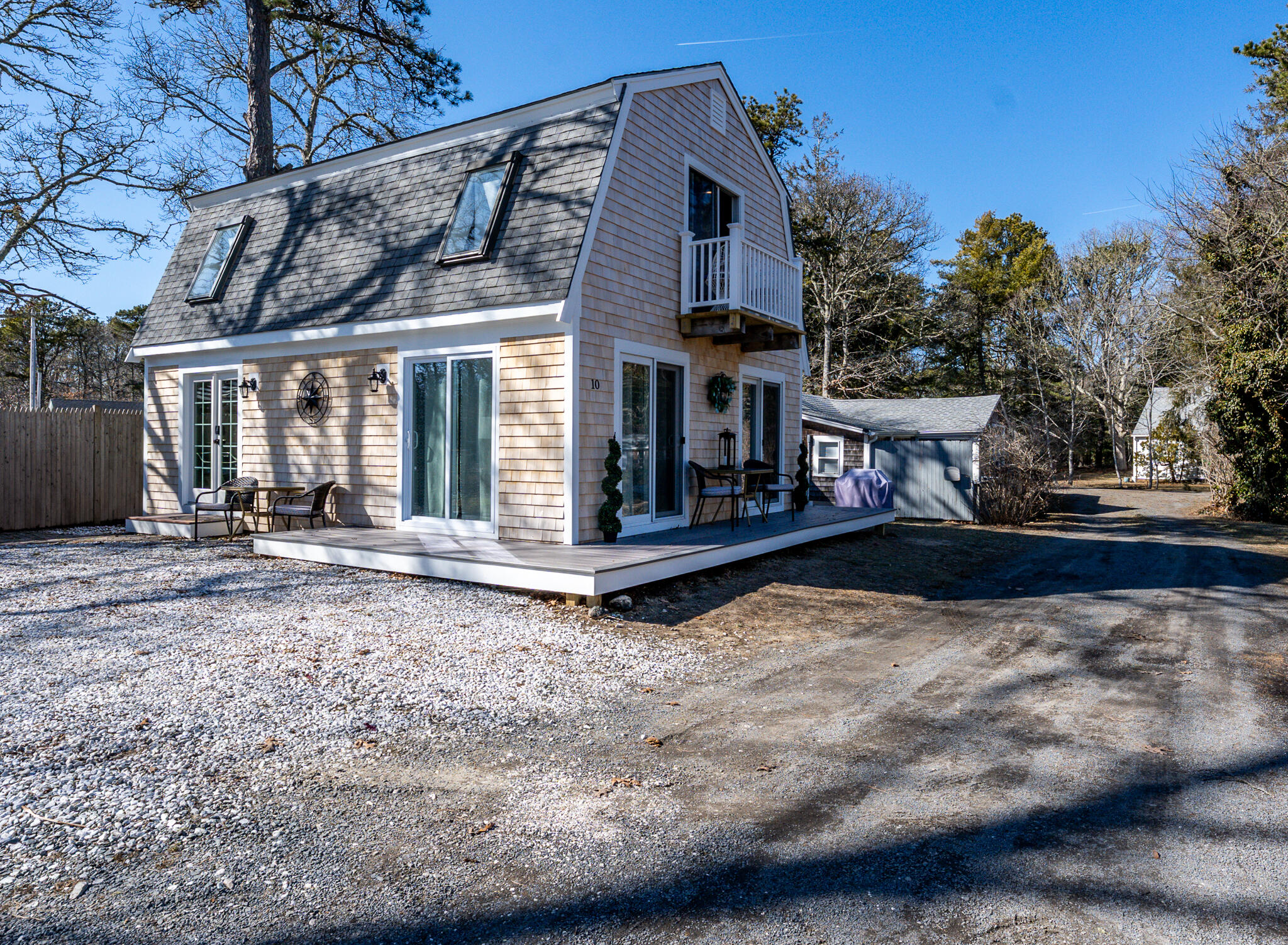 9 Bells Neck Road, Unit 10 Harwich, MA 02671 - Photo 35 of 39 a view of a house with large trees