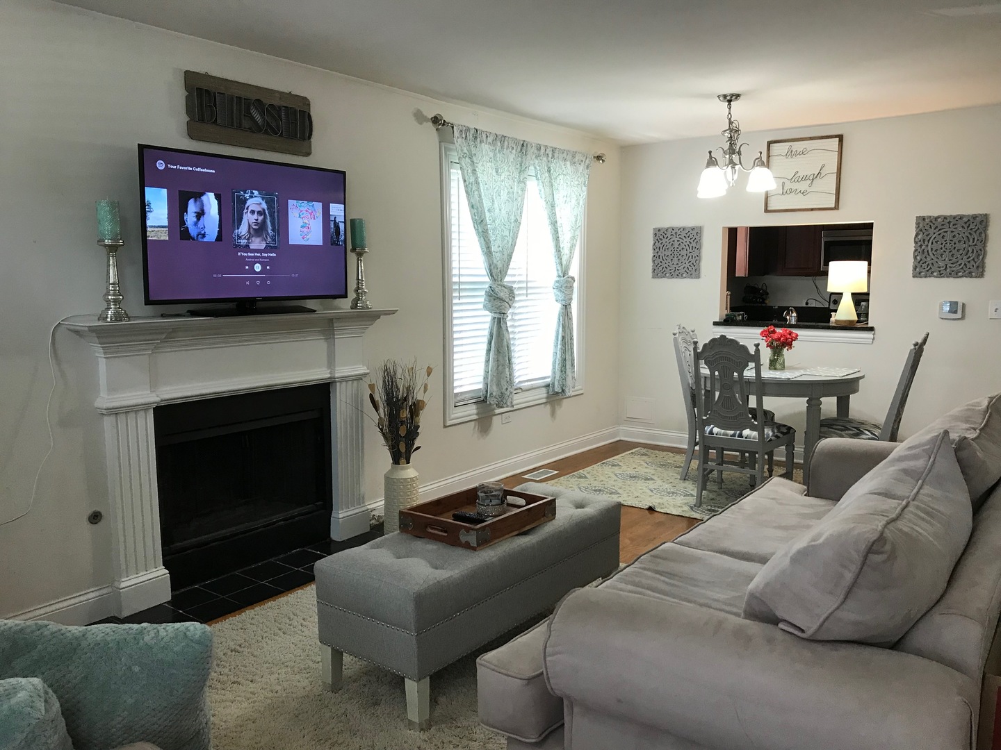 43 Foxcroft Road, Unit 123 Naperville, IL 60565 - Photo 2 of 11 a living room with furniture a flat screen tv and a fireplace