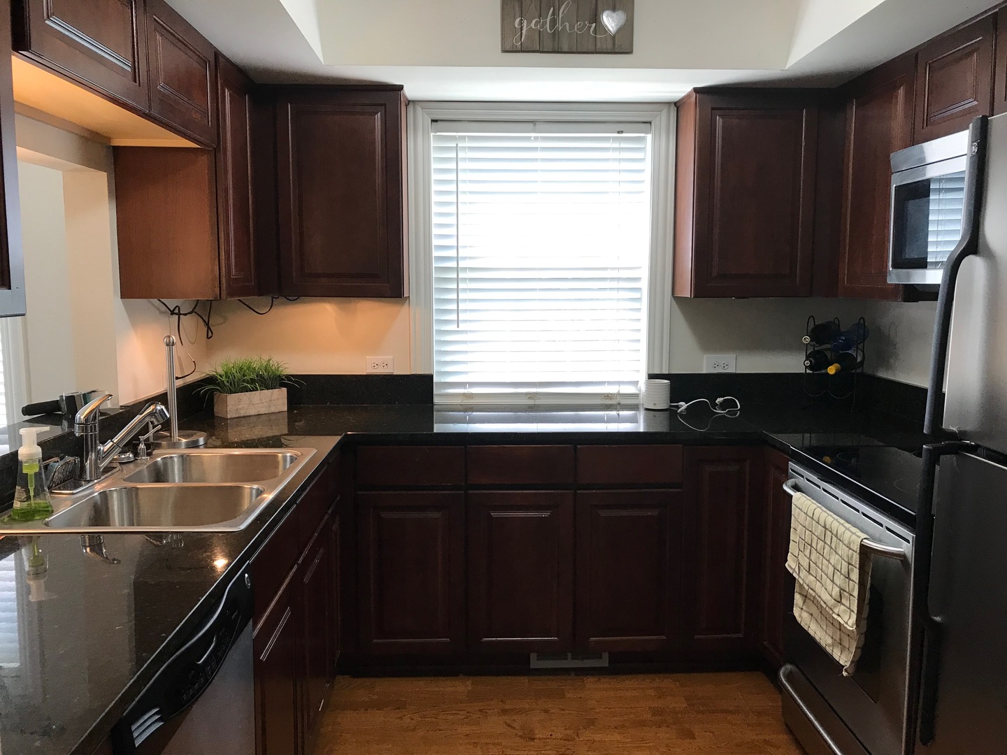 43 Foxcroft Road, Unit 123 Naperville, IL 60565 - Photo 5 of 11 a kitchen with a sink stove and microwave