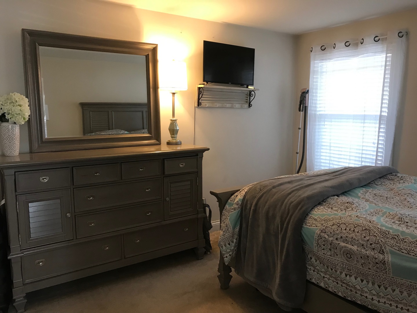 43 Foxcroft Road, Unit 123 Naperville, IL 60565 - Photo 9 of 11 a bedroom with a bed and a flat tv screen on dresser