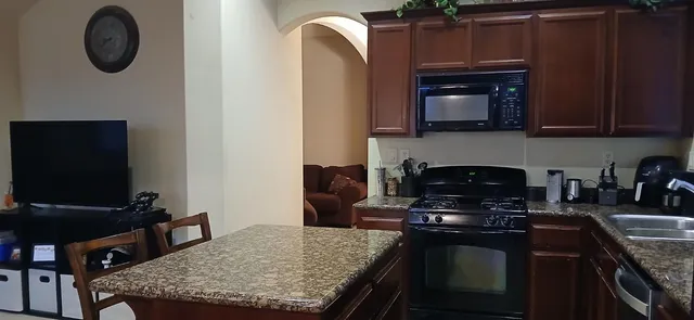 a kitchen with a stove and a microwave