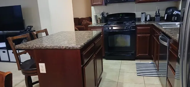 a kitchen with a stove and a microwave